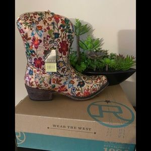 Cowgirl boots still in the box with the tags